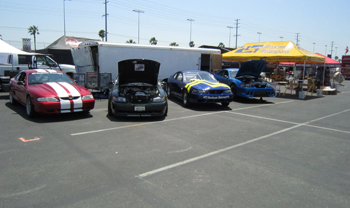 Four MM-equipped Mustangs on display in the MM booth: MM's 1996 for open-tracking, Michael's street and strip Bullitt, Jose Chavez's 10-second drag car, and the Wild Pony Motorsports street and show Mustang.
